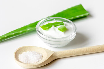 extract from aloe vera in glass bottle and cream macro