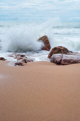Wave Crashing on Rocks at Banana Beach, Choeng Thale, Phuket, Thailand