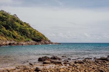 Rocky Shoreline and Hills at Yanui Beach, Phuket, Thailand
