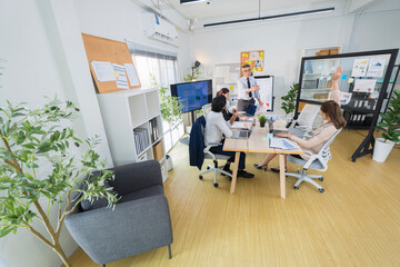 Business Professionals Discussing Project in Modern Office