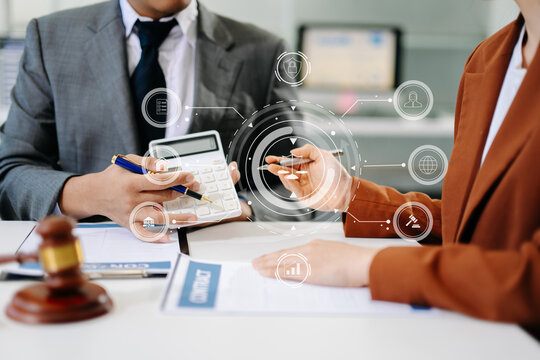 Digital law and justice concept with holographic icons, gavel, and scales in modern office, symbolizing innovation, legal technology