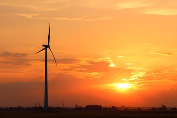 Obraz premium Sunset silhouette of wind turbine on farmland, blending technology & nature,