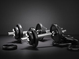 Pair of adjustable dumbbells with black plates and silver handles on a dark gray background. 