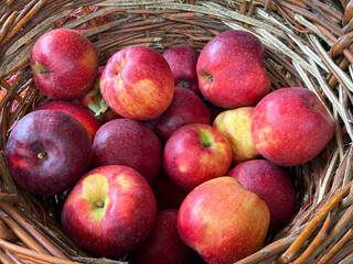 Fresh apples ripe red fruits in basket.
