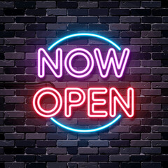 Obraz premium Neon now open sign glowing in pink and blue on dark brick wall