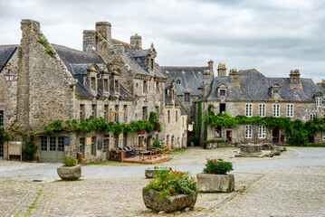 Picturesque  village square surrounded by stone houses. Photograph taken in Locronan, Brittany, France.
