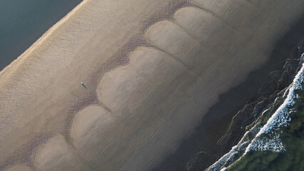 Aerial View of Person Walking on Beach with Tidal Sand Patterns