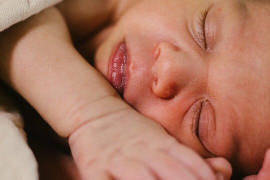 Close up of newborn face baby boy of mixed race