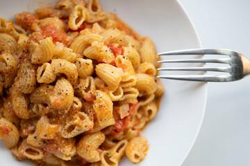 Vegan lentil pasta with basil and tomato pesto, fresh ingredients, healthy meal