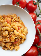Vegan lentil pasta with basil and tomato pesto, fresh ingredients, healthy meal