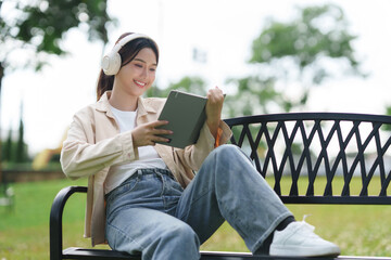 Young woman enjoying open air leisure listening music