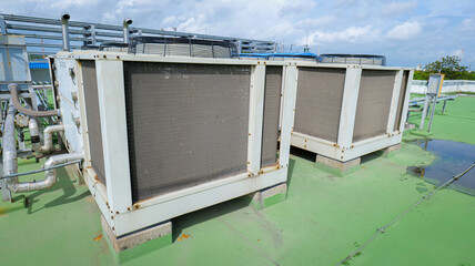 HVAC (Heating, Ventilation, and Air Conditioning) units installed on the rooftop of a modern...