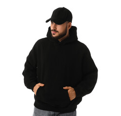 Young man in black hoodie with cap on white background