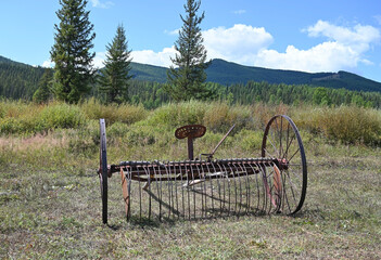 Old farm equipment in a field