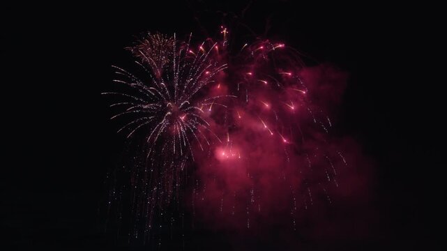 Festive fireworks exploding during the celebration. Slow motion
