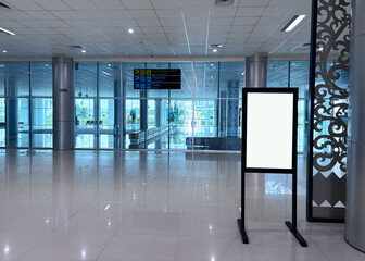 Empty sign stands in airport terminal waiting for passengers to arrive, creating a sense of anticipation and travel excitement.