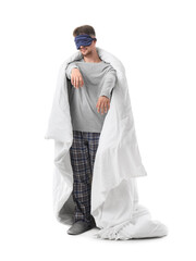 Male sleepwalker with blanket on white background