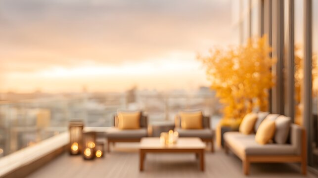 Luxury rooftop lounge INTENTIONALLY BLURRED IMAGE with golden sunset and fall décor