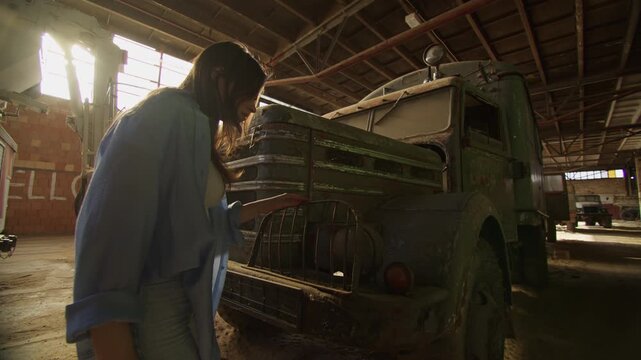 Exploring an abandoned warehouse with old rusty trucks and hidden treasures
