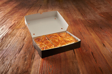 Delicious homemade savory pie with golden crispy layers, baked to perfection in a round tray. Perfect for family gatherings, traditional meals, or food photography showcasing authentic baked pastry.