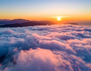 Aerial view of a stunning sunrise over a sea of fluffy clouds