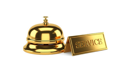 The shiny gold service bell sits on the hotel reception desk, ready for a customer to ring it for assistance