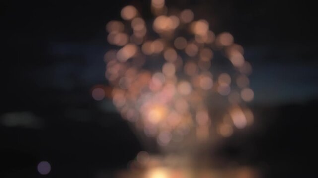 Colorful fireworks display in abstract blurry bokeh background. Slow motion
