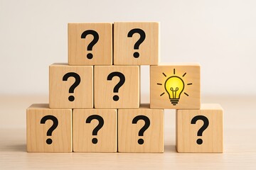 Wooden question mark blocks pyramid with glowing light bulb symbolizing idea innovation thinking creativity knowledge and problem solving concept success business education intelligence inspiration.