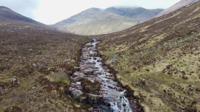 Aerial footage revealing the stunning Eas a'Bhradain Waterfall in the Scottish Highlands