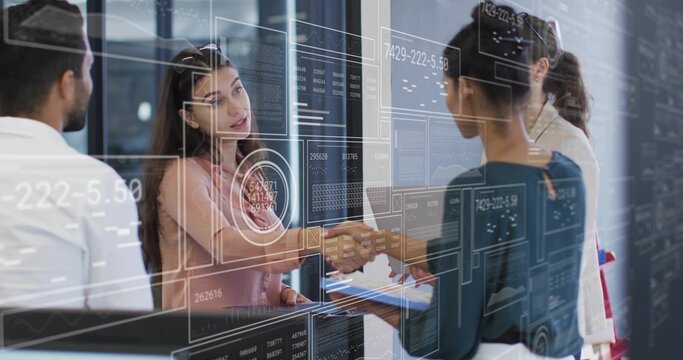 Business professionals shaking hands across glass table in office, featuring digital interface
