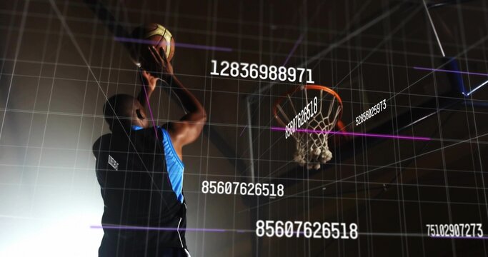 Jumping athlete wearing jersey raising basketball toward hoop in gym, with data overlay, copy space
