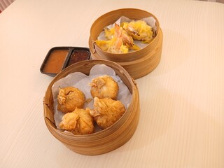 dim sum dumpling on bamboo wooden basket bowl