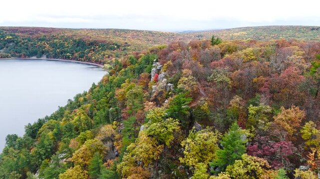 Aerial Shot Of Cliff Formations Overlooking Lake During Fall in Wisconsin 