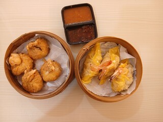 dim sum dumpling on bamboo wooden basket bowl