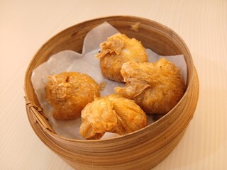 dim sum dumpling on bamboo wooden basket bowl