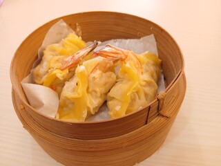 dim sum dumpling on bamboo wooden basket bowl