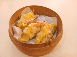 dim sum dumpling on bamboo wooden basket bowl