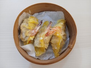 dim sum dumpling on bamboo wooden basket bowl