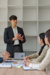 Business team discussing marketing strategy during meeting
