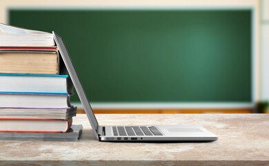 Open laptop with a blank screen in school classroom