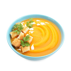 Tasty pumpkin cream soup with parsley and croutons isolated on white