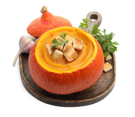 Tasty pumpkin cream soup with croutons and parsley in pumpkin isolated on white