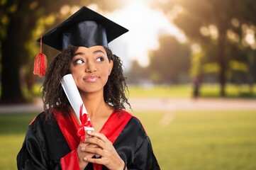 Happy portrait young woman on graduation for celebration