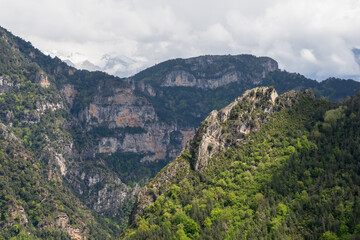 Fototapeta premium tree lined rock outrcrops and glacial formations, gorges and canyons in mountains, Spain