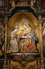 Obraz premium Seville, Spain 03.25.2019: Saint Anne teaching Virgin Mary to read, sculptures from 1714 by Jose Montes