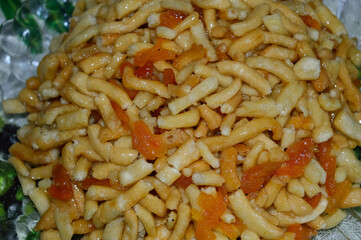 Close-up of chak-chak with dried apricots on a plate