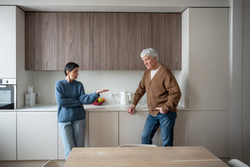 Mad woman in frustration toward husband, marital disagreement between elderly couple. Heated...