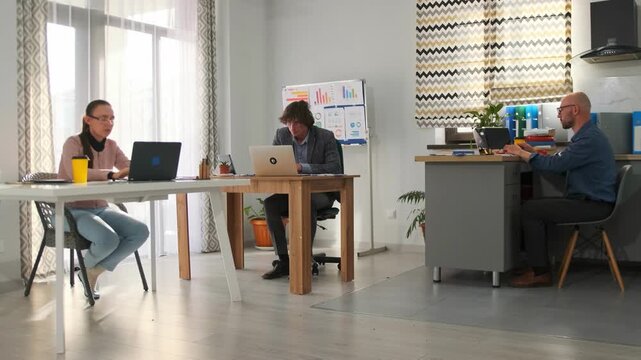 professional collaboration space, independent professionals collaborating at shared wooden table, group of independent professionals and managers collaborating effectively in shared workspace