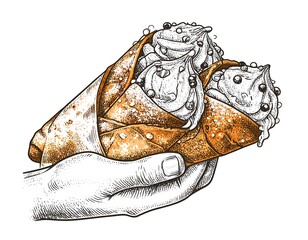 Hand holding two beautifully decorated, cream-filled pastry cones