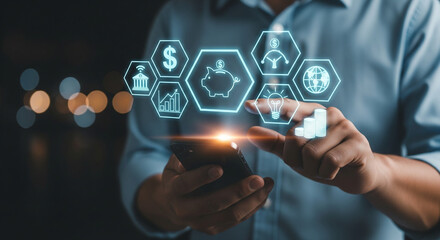 Digital Finance at Your Fingertips: A close-up shot of a person using a smartphone to interact with illuminated digital icons representing finance concepts like money and investments.